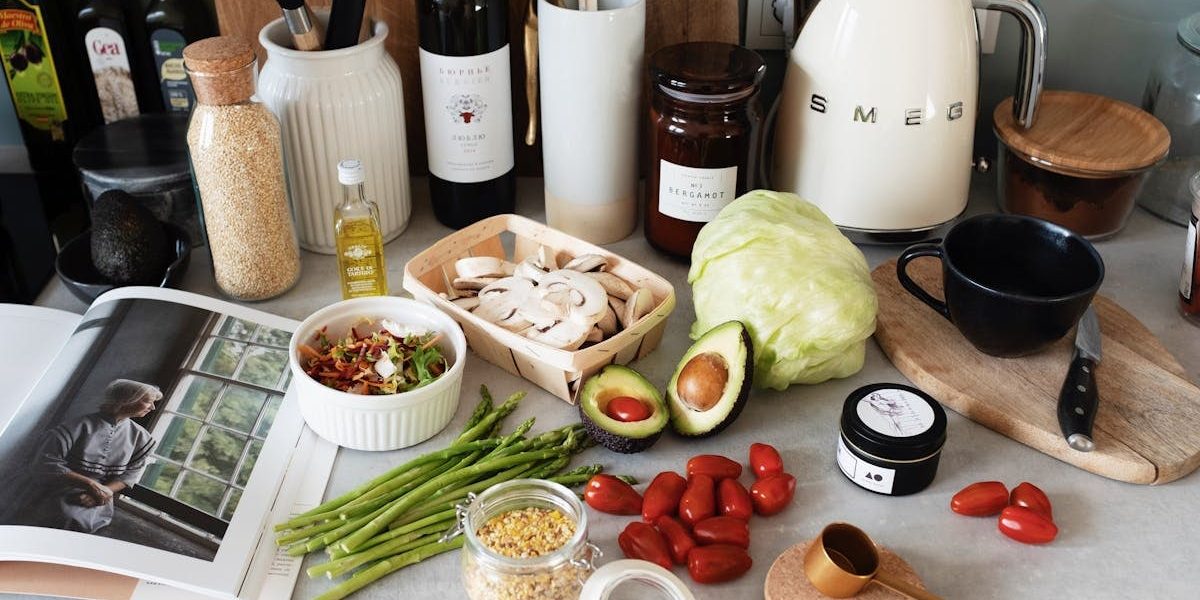 A variety of fresh ingredients and kitchen tools for preparing a healthy meal.